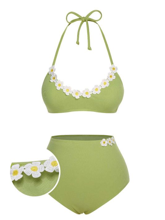 She's wearing 1960s Halter Knit Daisy Swimsuit and the whole beach remembers the 1960s