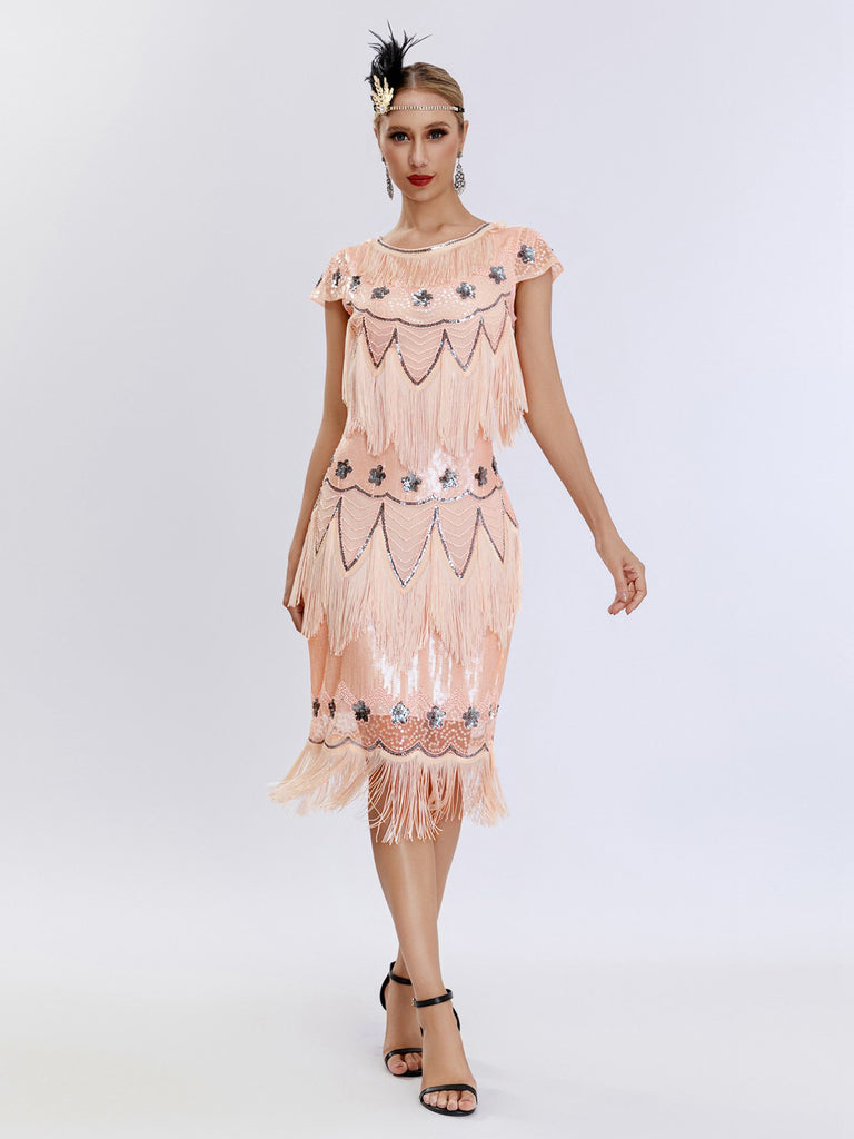 This 1920s Charleston Sequins Tassel Patchwork Dress wraps her in 1920s elegance, one twirl at a time