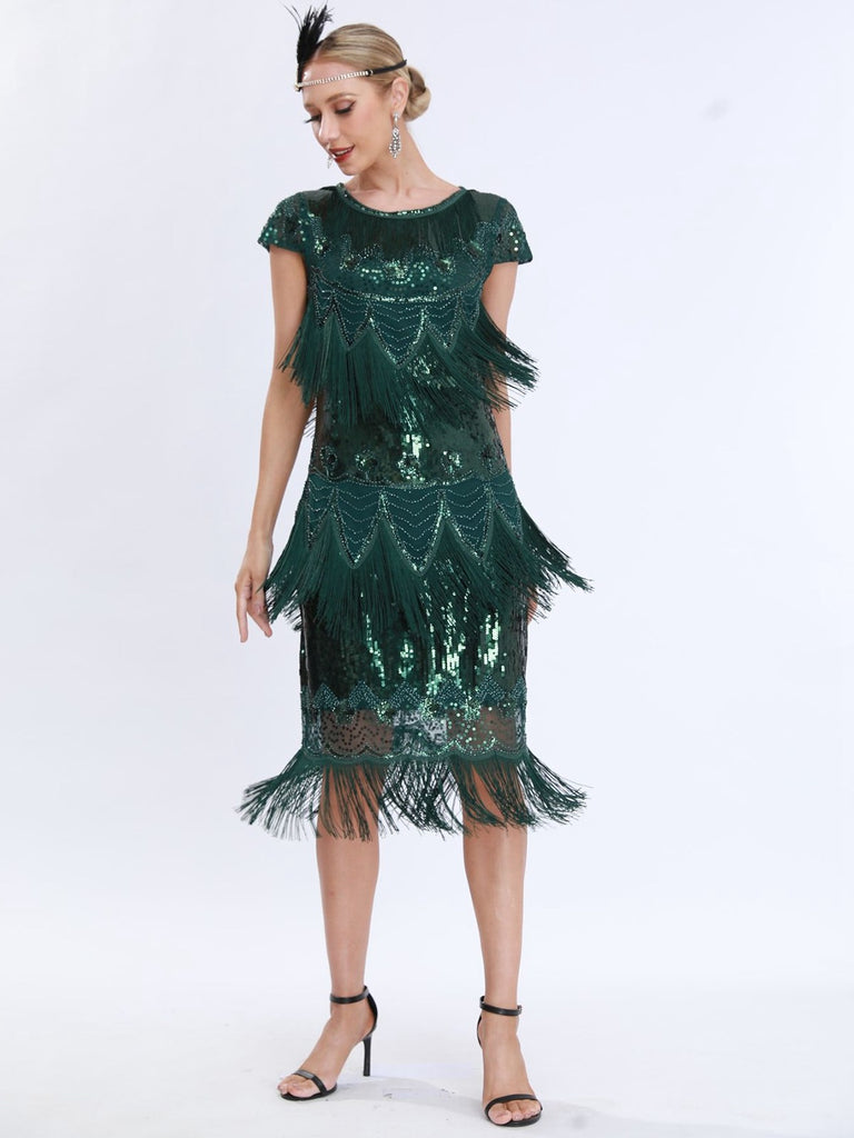 This 1920s Charleston Sequins Tassel Patchwork Dress wraps her in 1920s elegance, one twirl at a time