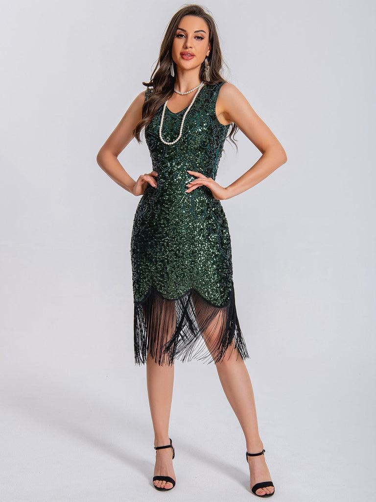 This 1920s V-Neck Symmetrical Pattern Tassel Sequined Dress wraps her in 1920s elegance, one twirl at a time