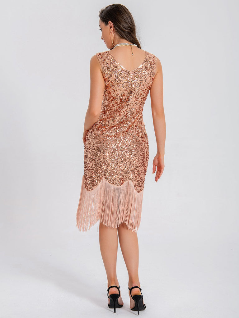 This 1920s V-Neck Symmetrical Pattern Tassel Sequined Dress wraps her in 1920s elegance, one twirl at a time