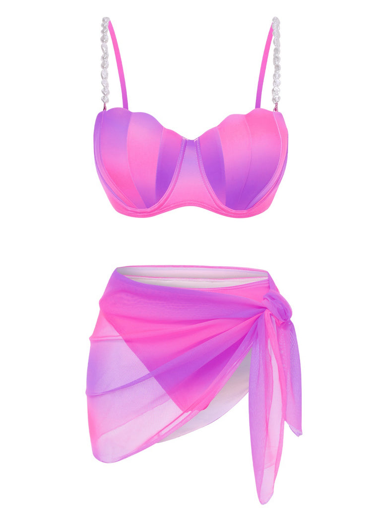 She's wearing 1940s Color Gradient Shell Bikini Set & Cover-Up and the whole beach remembers the 1940s