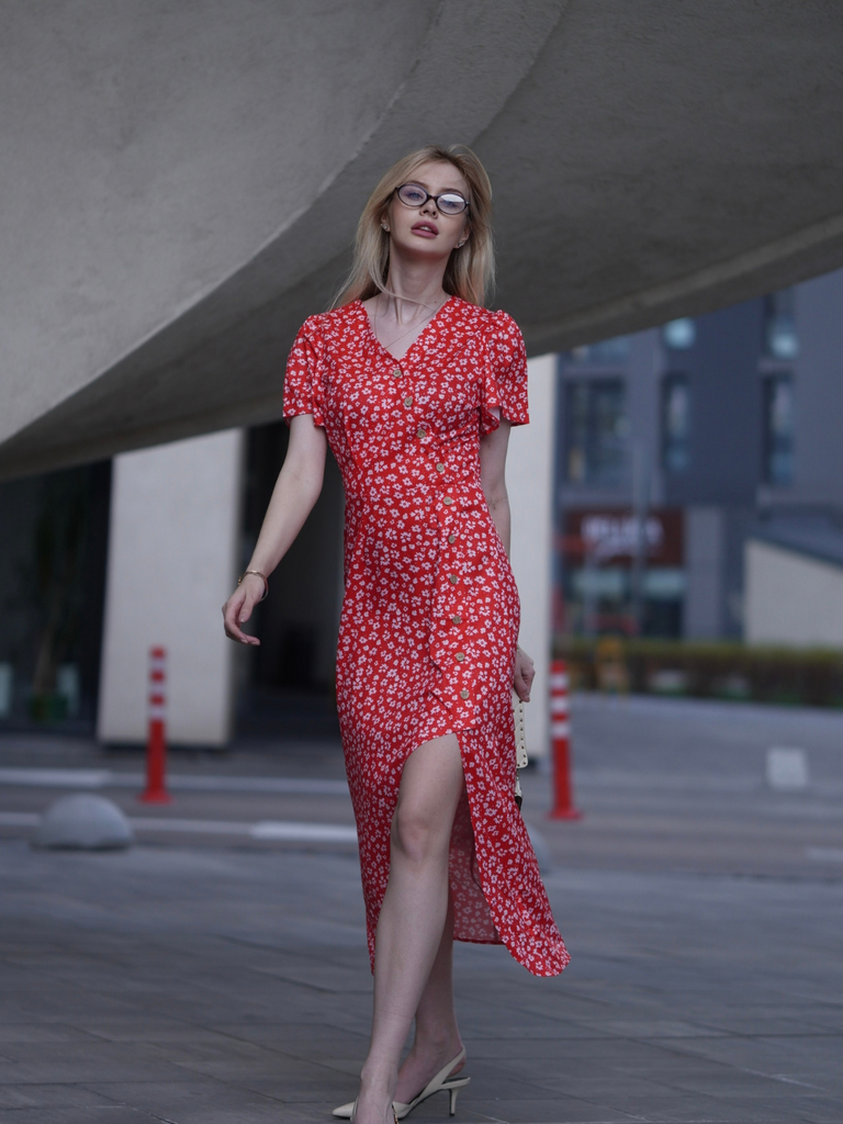 She slips into this 1940s Floral V-Neck Added Button Dress and suddenly it's a 1940s daydream
