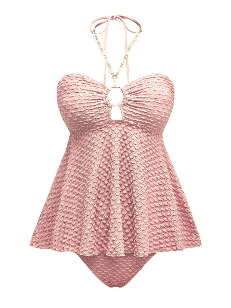 She's wearing 1940s Seashell Chain Lace-Up Halter Swimsuit and the whole beach remembers the 1940s