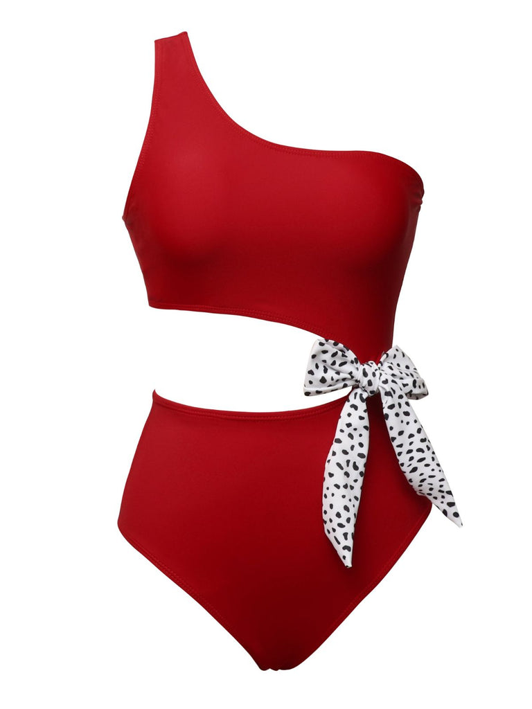 This 1940s Solid Waist Hollow Dots Bow Patchwork Swimsuit carries 1940s vacation dreams in every stitch