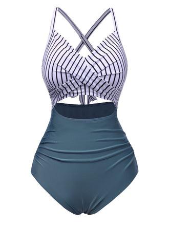 She's wearing 1940s Stripe Patchwork Hollow One-Piece Swimsuit and the whole beach remembers the 1940s
