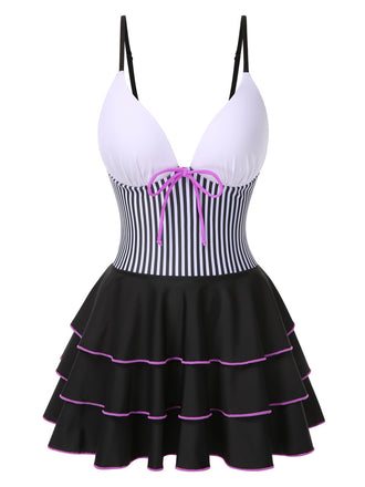 She slips into this 1940s Stripe Patchwork Layered Hem Swim Dress and suddenly it's a 1940s daydream