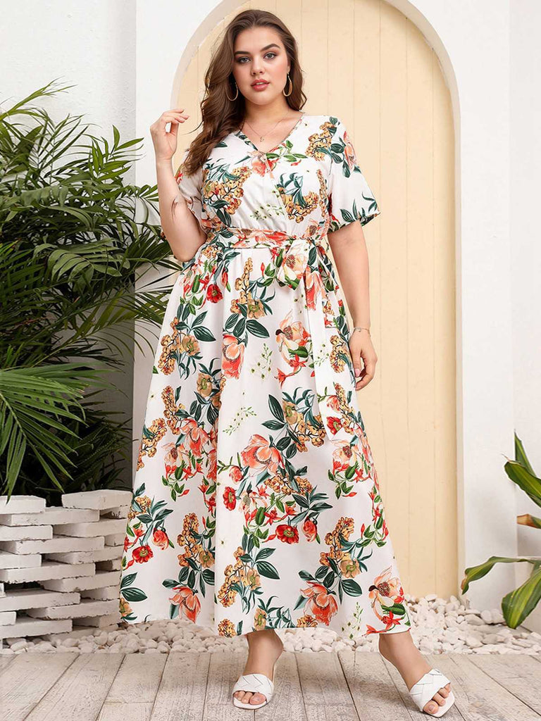 She slips into this 1940s Surplice V-Neck Belted Floral Dress and suddenly it's a 1940s daydream