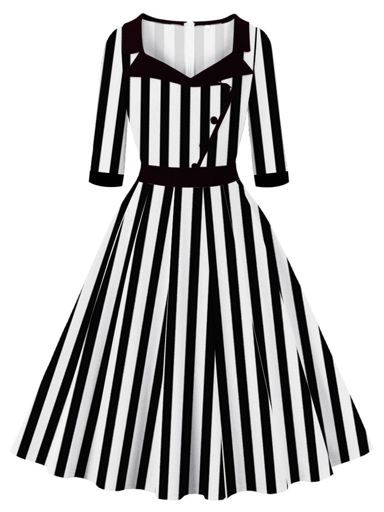 She slips into this 1950S Lapel Black & White Stripes Dress and suddenly it's a 1950s daydream
