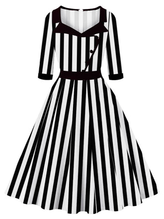 She slips into this 1950S Lapel Black & White Stripes Dress and suddenly it's a 1950s daydream