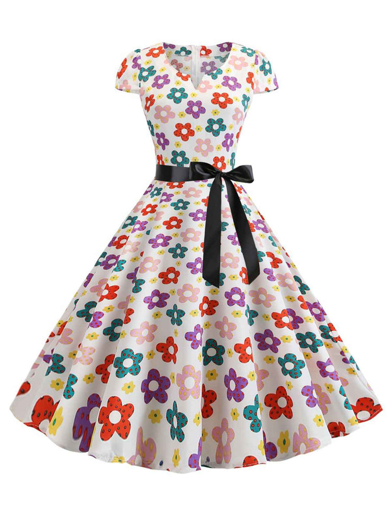 She slips into this 1950s Cap Sleeve Polka Dot Belted Dress and suddenly it's a 1950s daydream