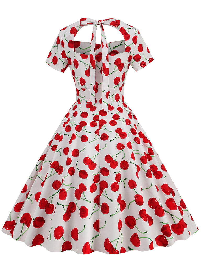 This 1950s Cherry Sweetheart Short Sleeve Lace Up Dress wraps her in 1950s elegance, one twirl at a time