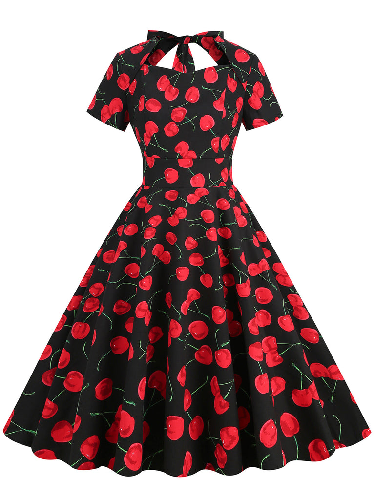 She slips into this 1950s Cherry Sweetheart Short Sleeve Lace Up Dress and suddenly it's a 1950s daydream