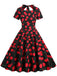 She slips into this 1950s Cherry Sweetheart Short Sleeve Lace Up Dress and suddenly it's a 1950s daydream