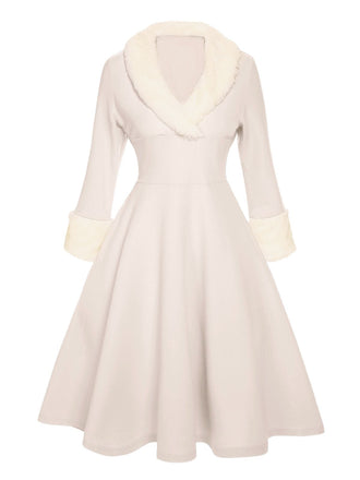 She slips into this 1950s Christmas Lapel Dress and suddenly it's a 1950s daydream