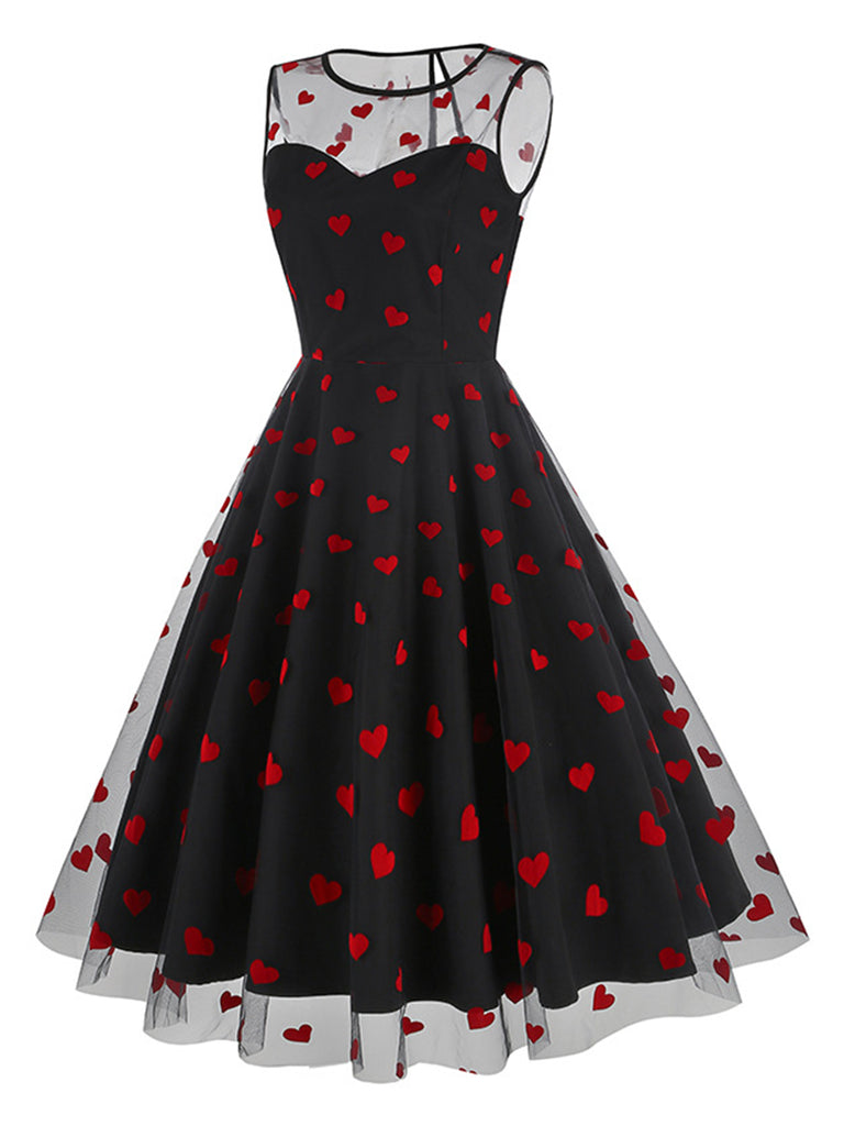 She slips into this 1950s Flocked Heart Mesh Patchwork Dress and suddenly it's a 1950s daydream