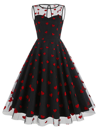 She slips into this 1950s Flocked Heart Mesh Patchwork Dress and suddenly it's a 1950s daydream