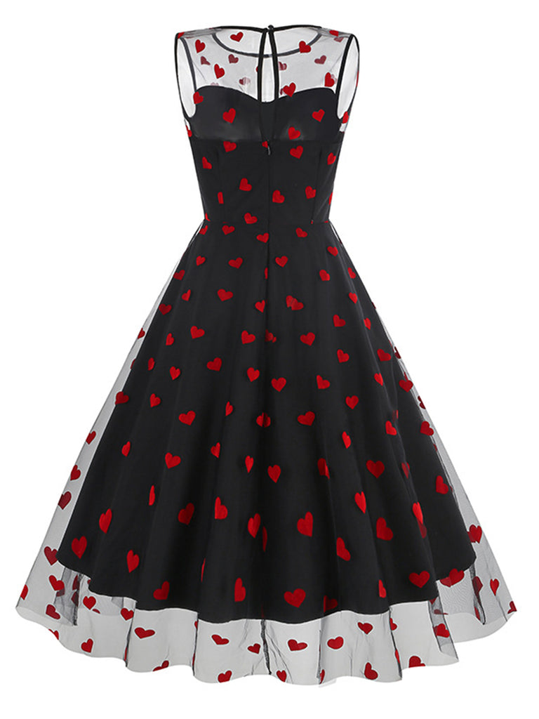 This 1950s Flocked Heart Mesh Patchwork Dress wraps her in 1950s elegance, one twirl at a time