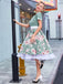 She slips into this 1950s Floral Patchwork Swing Dress and suddenly it's a 1950s daydream
