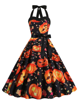She slips into this 1950s Halloween Pumpkin Face Halter Dress and suddenly it's a 1950s daydream