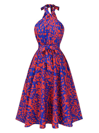 She slips into this 1950s Halter Abstract Print Backless Swing Dress and suddenly it's a 1950s daydream
