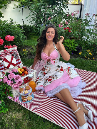 She slips into this 1950s Halter Floral Swing Dress and suddenly it's a 1950s daydream