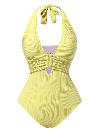She's wearing 1950s Halter Hollow U-Ring Textured Swimsuit and the whole beach remembers the 1950s