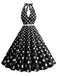 She slips into this 1950s Halter Polka Dot Print Swing Dress and suddenly it's a 1950s daydream