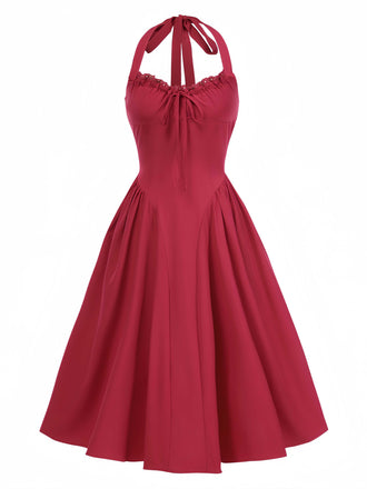 She slips into this 1950s Halter Solid Swing Corset Dress and suddenly it's a 1950s daydream