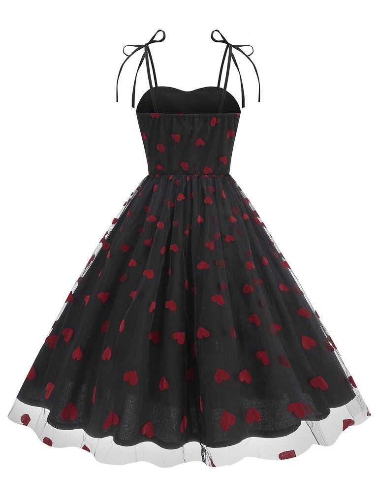 She slips into this 1950s Heart Mesh Patchwork Suspender Dress and suddenly it's a 1950s daydream