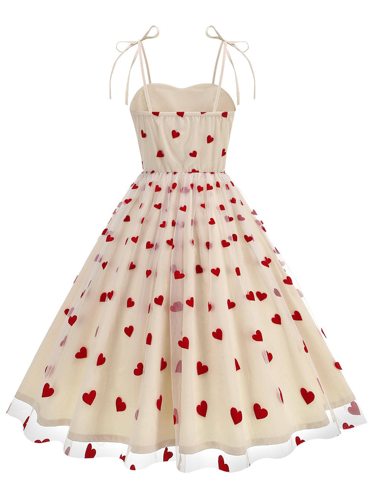 This 1950s Heart Mesh Patchwork Suspender Dress wraps her in 1950s elegance, one twirl at a time
