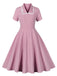 She slips into this 1950s Lapel Buttoned Short Sleeve Solid Dress and suddenly it's a 1950s daydream