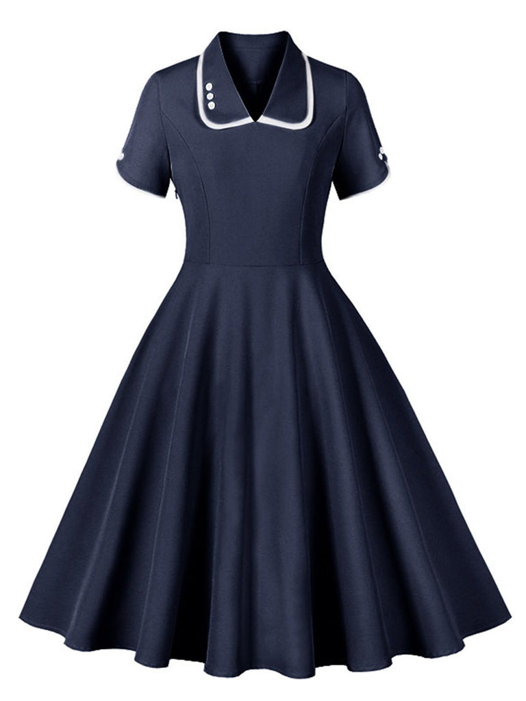 She slips into this 1950s Lapel Buttoned Short Sleeve Solid Dress and suddenly it's a 1950s daydream