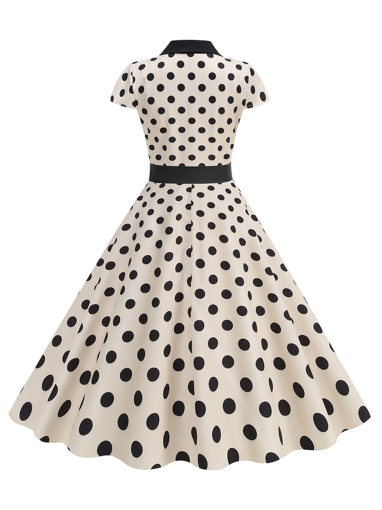 1950s Lapel Polka Dots Bow Swing Dress — the kind of 1950s dress that makes strangers smile
