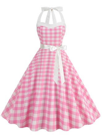 She slips into this 1950s Polka Dot Halter Belt Swing Dress and suddenly it's a 1950s daydream