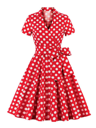 This 1950s Polka Dots Waist Tie Lapel Dress wraps her in 1950s elegance, one twirl at a time