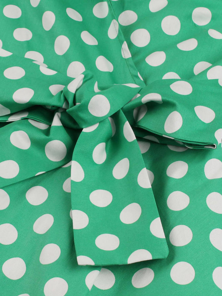 This 1950s Polka Dots Waist Tie Lapel Dress wraps her in 1950s elegance, one twirl at a time