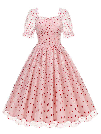 She slips into this 1950s Puff Sleeve Valentine Heart Mesh Dress and suddenly it's a 1950s daydream