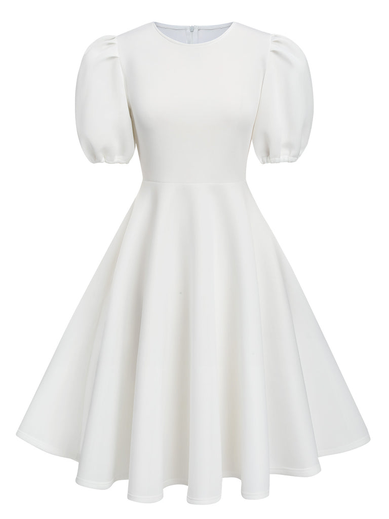 She slips into this 1950s Round Neck Puff Sleeve A-Line Dress and suddenly it's a 1950s daydream