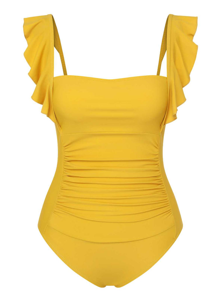 She's wearing 1950s Ruffles Backless Solid One-Piece Swimsuit and the whole beach remembers the 1950s