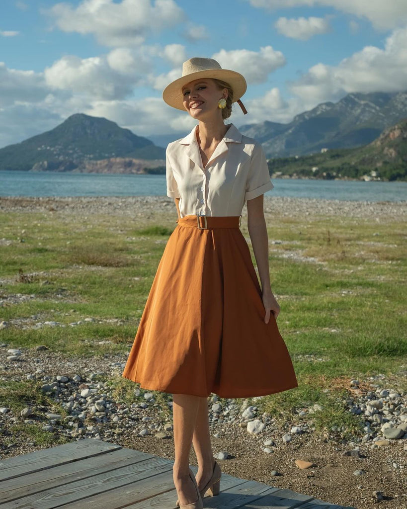 She slips into this 1950s Snow Style Button Dress and suddenly it's a 1950s daydream