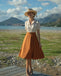 She slips into this 1950s Snow Style Button Dress and suddenly it's a 1950s daydream