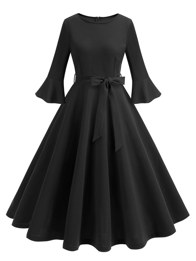 She slips into this 1950s Solid Bell Sleeves Swing Dress and suddenly it's a 1950s daydream