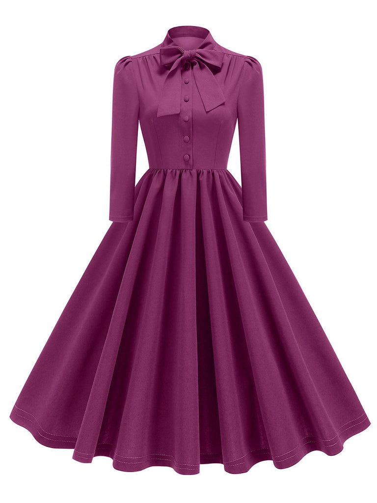 She slips into this 1950s Solid Bow Collar Buttoned Swing Dress and suddenly it's a 1950s daydream