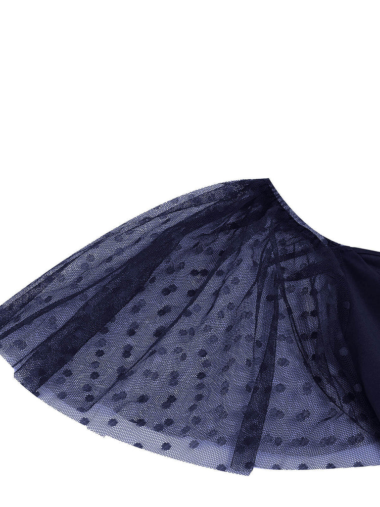 She slips into this 1950s Solid Dots Mesh Sleeve V-Neck Dress and suddenly it's a 1950s daydream