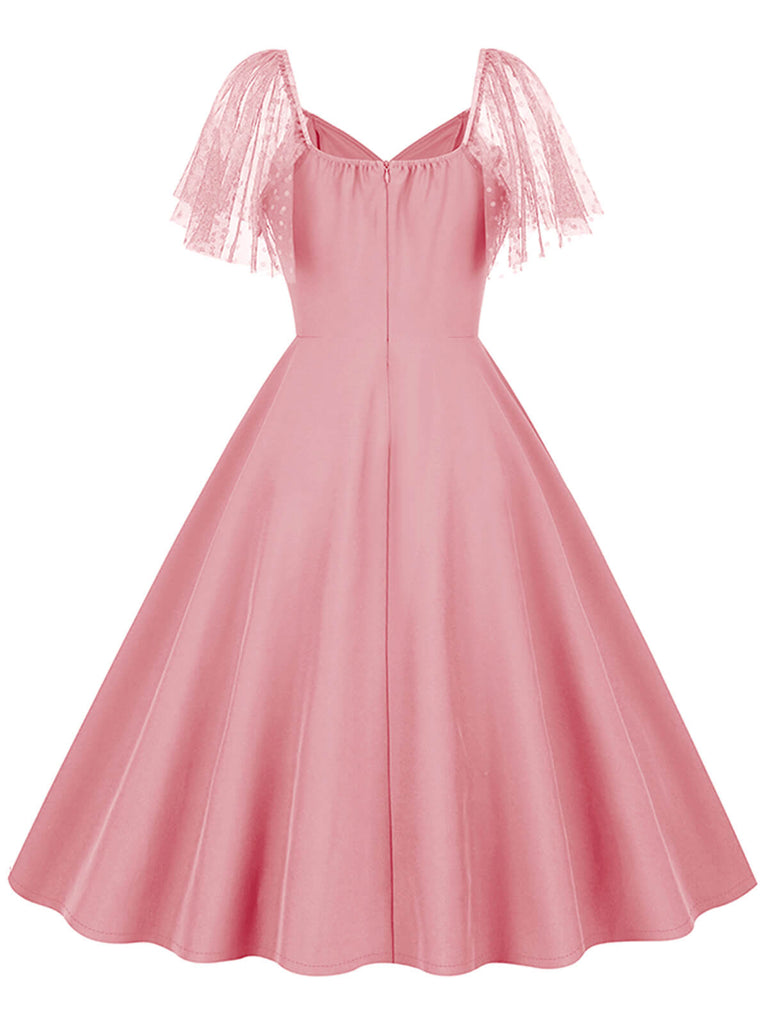 This 1950s Solid Dots Mesh Sleeve V-Neck Dress wraps her in 1950s elegance, one twirl at a time