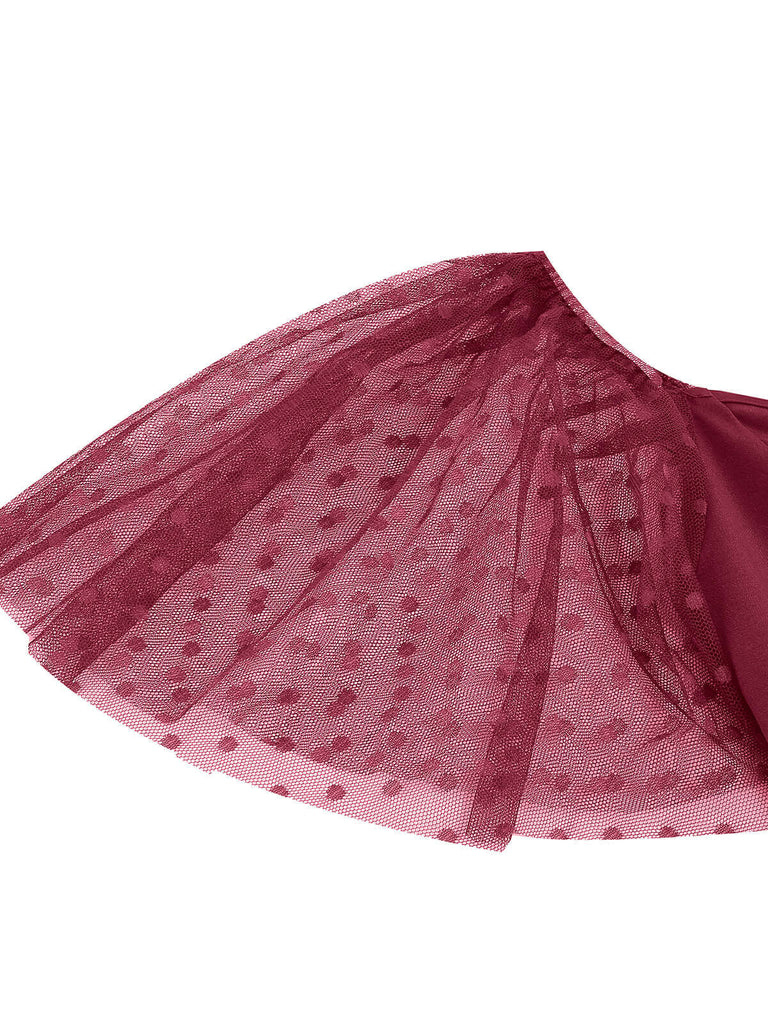 This 1950s Solid Dots Mesh Sleeve V-Neck Dress wraps her in 1950s elegance, one twirl at a time