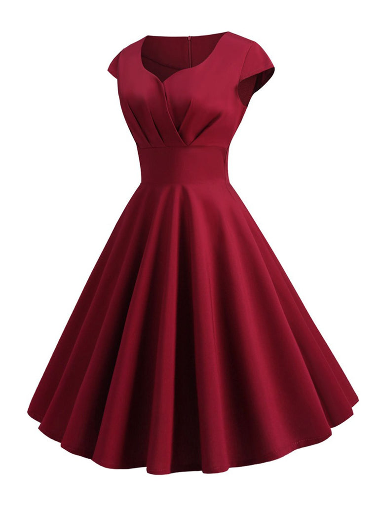She slips into this 1950s Solid Heart Neck Short Sleeve Dress and suddenly it's a 1950s daydream