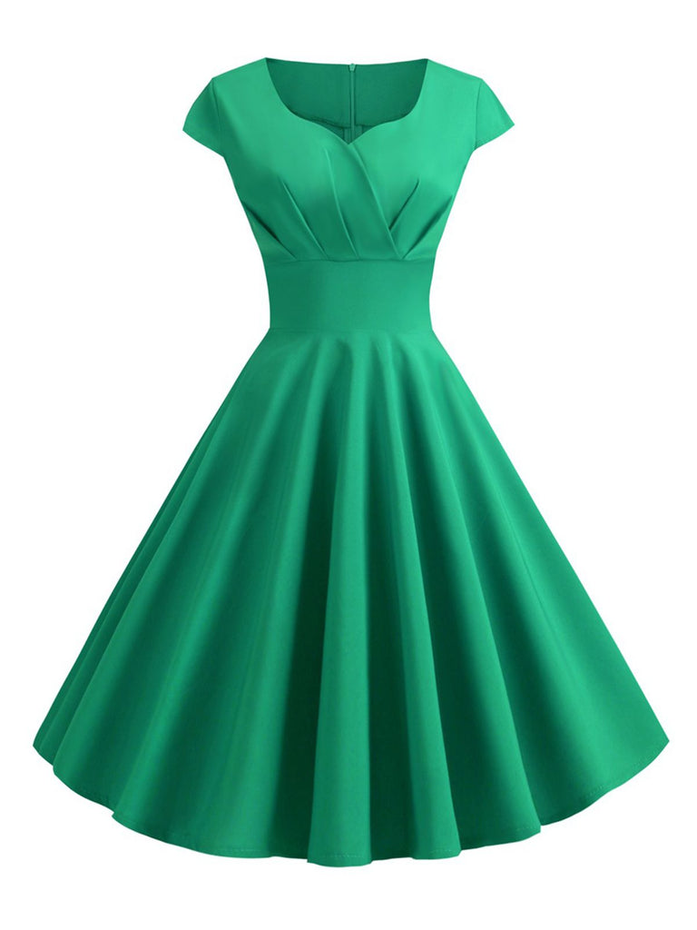 She slips into this 1950s Solid Heart Neck Short Sleeve Dress and suddenly it's a 1950s daydream