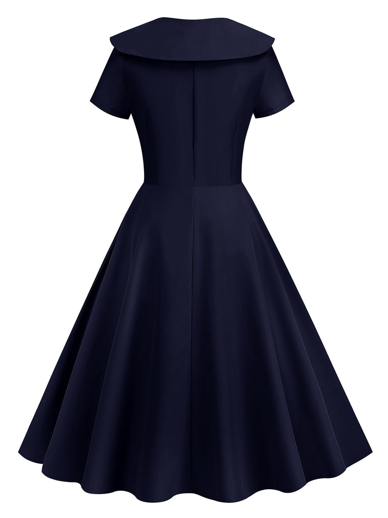 This 1950s Solid Lapel Swing Dress wraps her in 1950s elegance, one twirl at a time